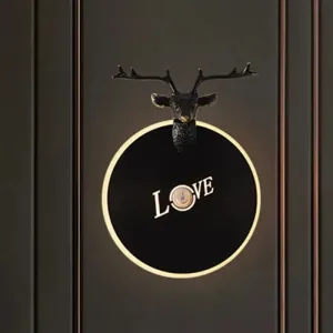 Metal Round Panel LED Wall Sconce in Brass/Black with Elk Decoration - Perfect for Traditional Living Rooms